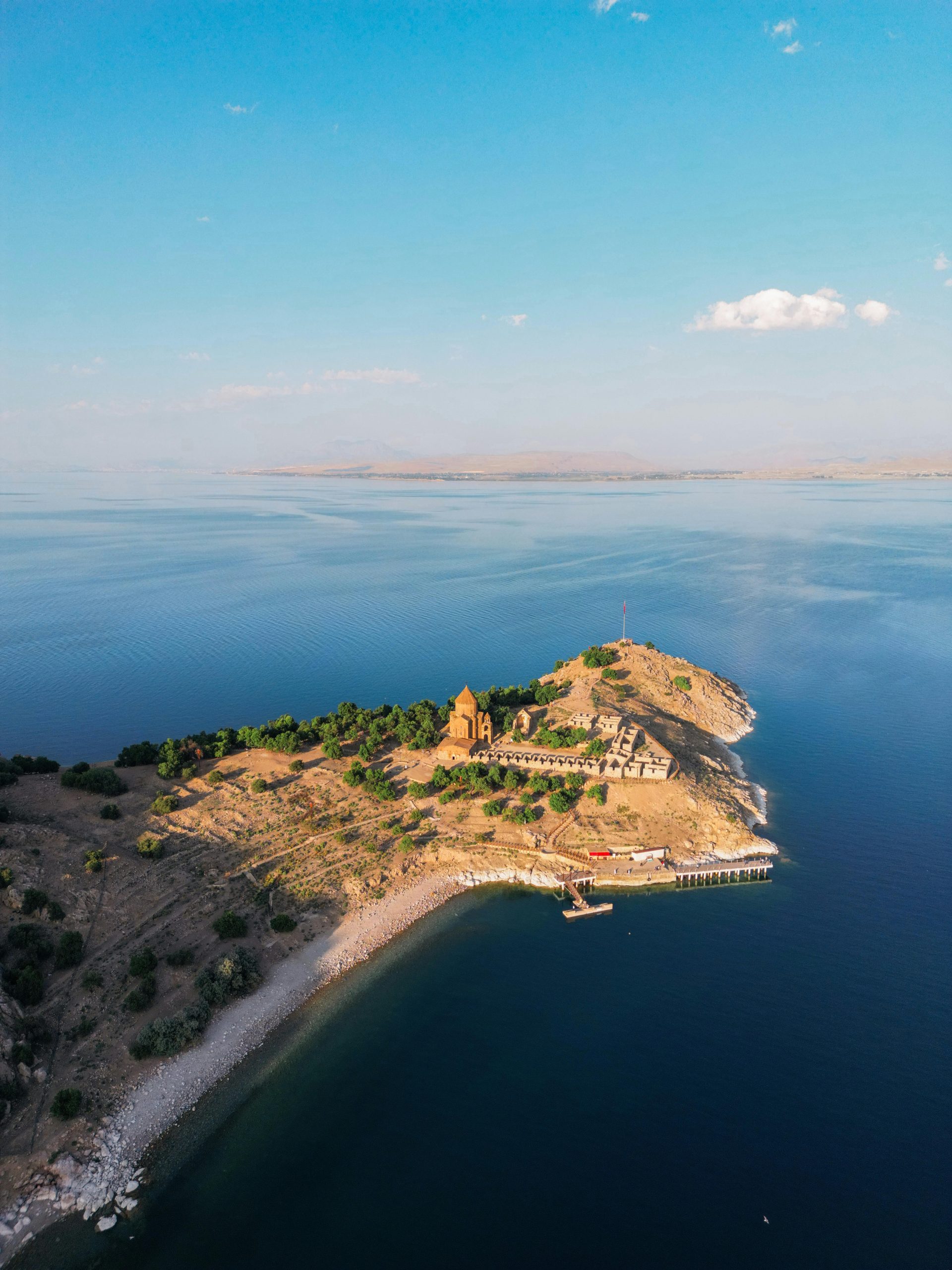 Stunning aerial shot of Akdamar Island and Lake Van's clear blue waters in Turkey.